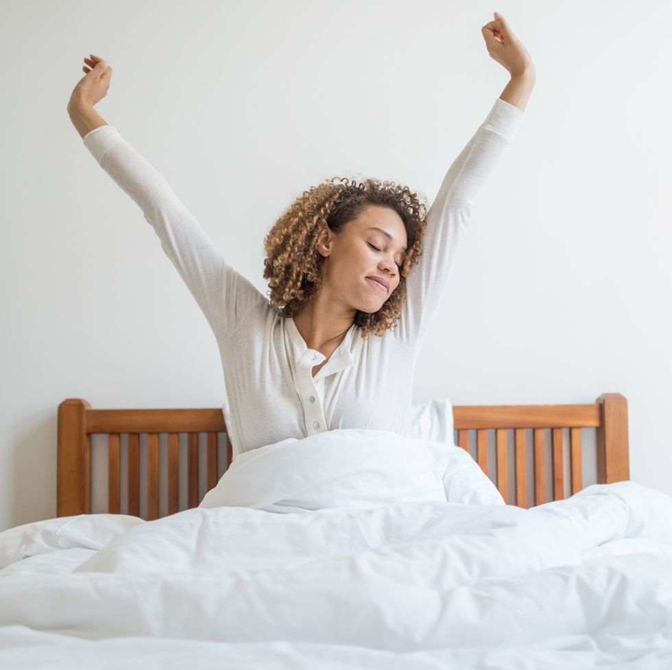 woman yawning in bed