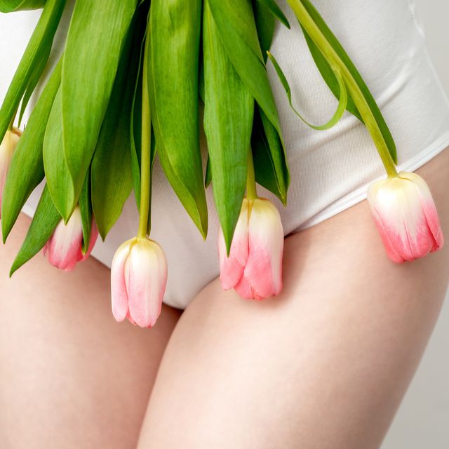 woman's bikini area with tulips