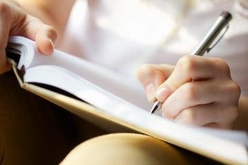 Woman's Hands, Pen and Book