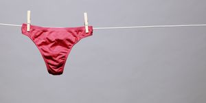 woman's red underwear hanging from line