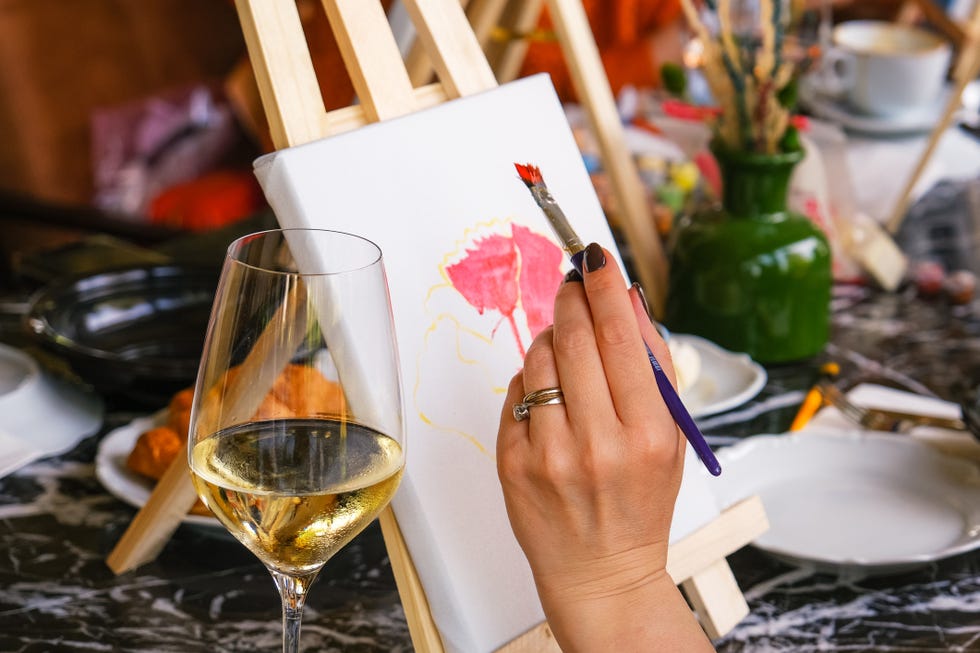 women drawing picture in art club cafe