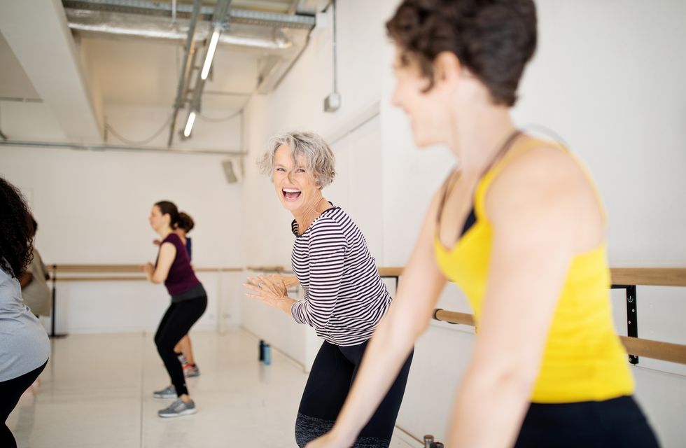 women enjoying a dance routine in fitness studio
