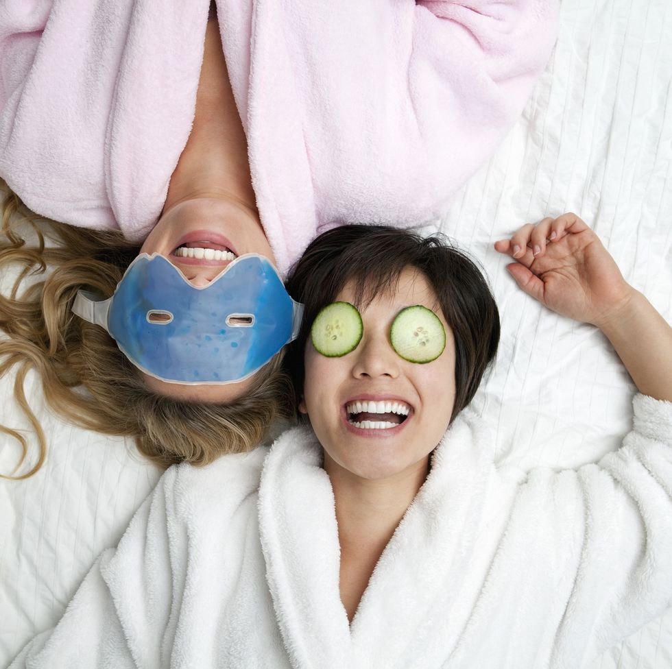 staycation ideas - Women in bathrobes wearing eye masks