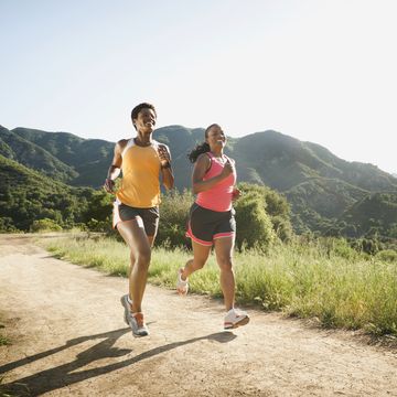 women running together on remote trail