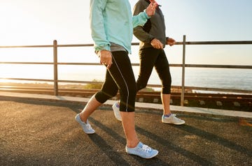 two women walking near the beach