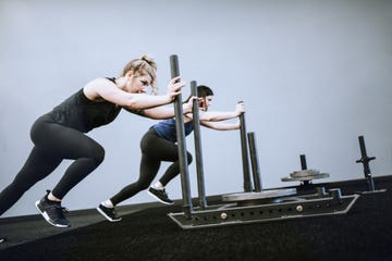 women's cross training gym with weighted prowler sleds