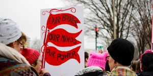 women's march with protest sign