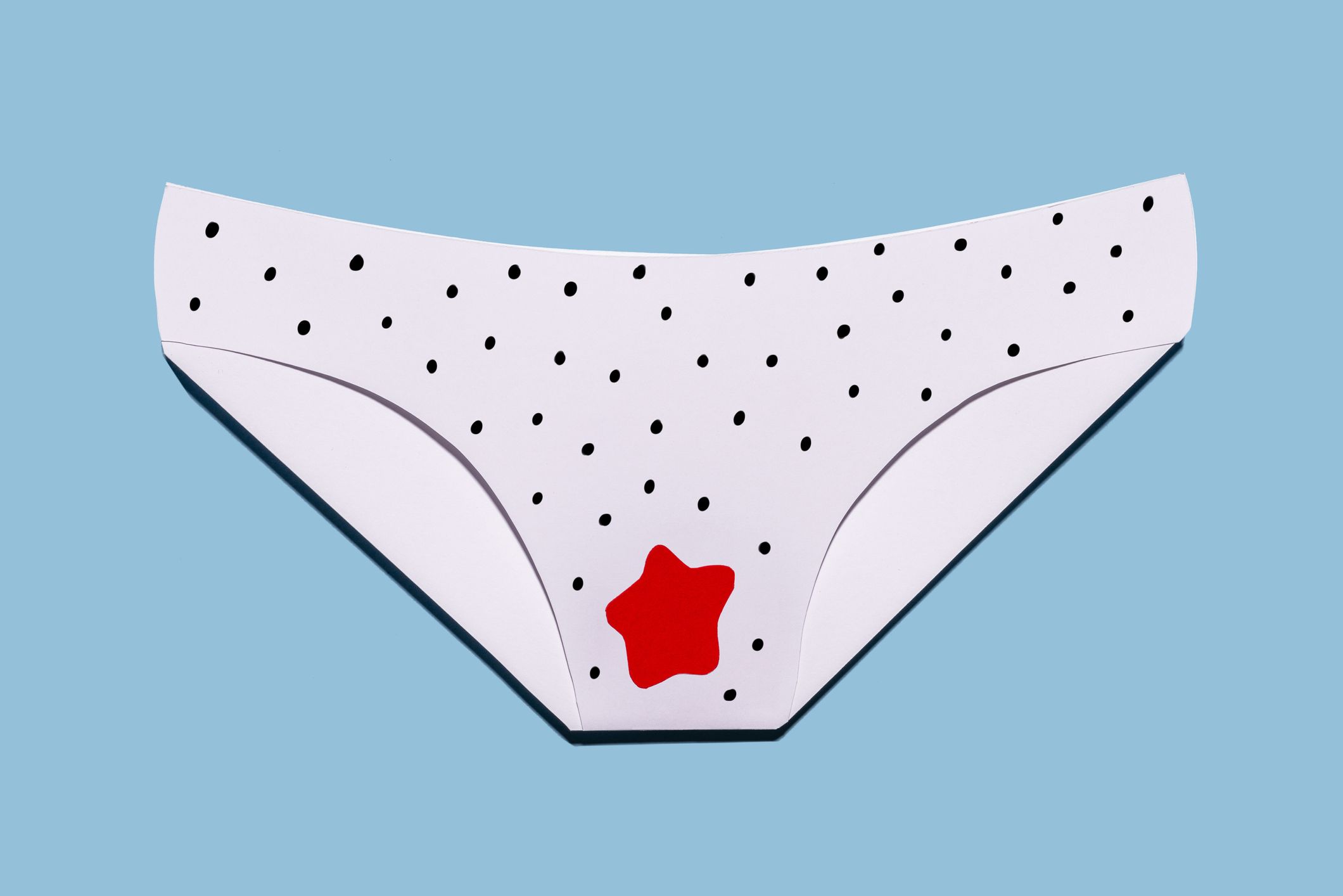 women's panties stained with menstrual blood, free bleeding on blue background