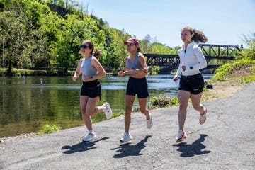 three woman running outdoors in warm weather