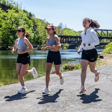 three woman running outdoors in warm weather three woman running outdoors in warm weather