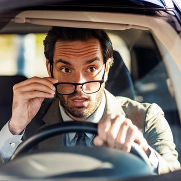 i wonder if this traffic will ever move, eyeglasses in hand