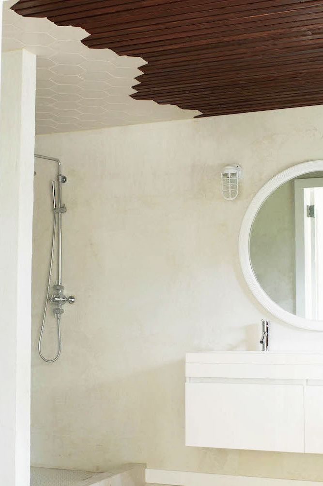 white bathroom with wood ceiling