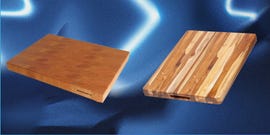 two wooden cutting boards on a blue textured background