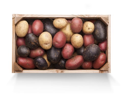 Wooden Crate of Mixed Potatoes on White