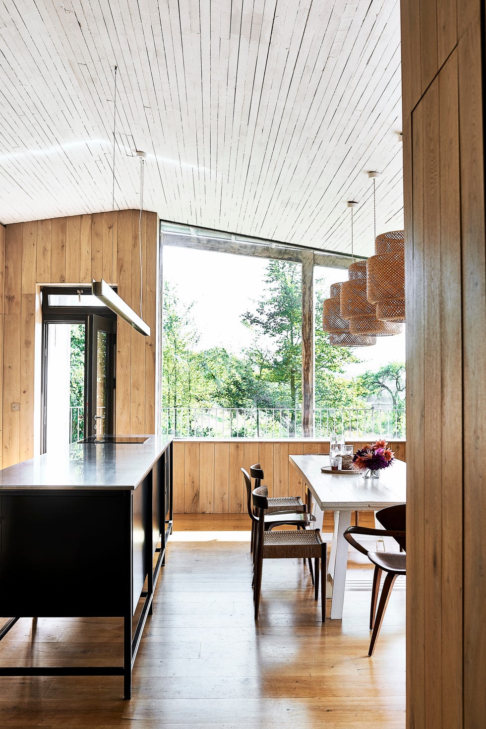 kitchen in new build eco home decorated with timber clad walls