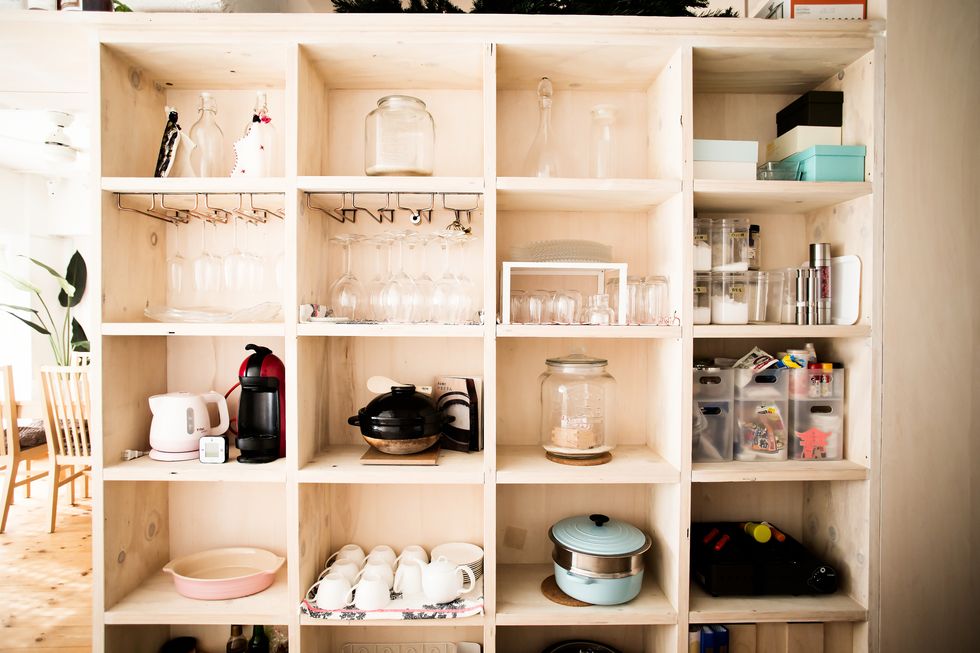 Wooden shelves with dishes arranged
