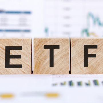 wooden text blocks of etf business and financial concept