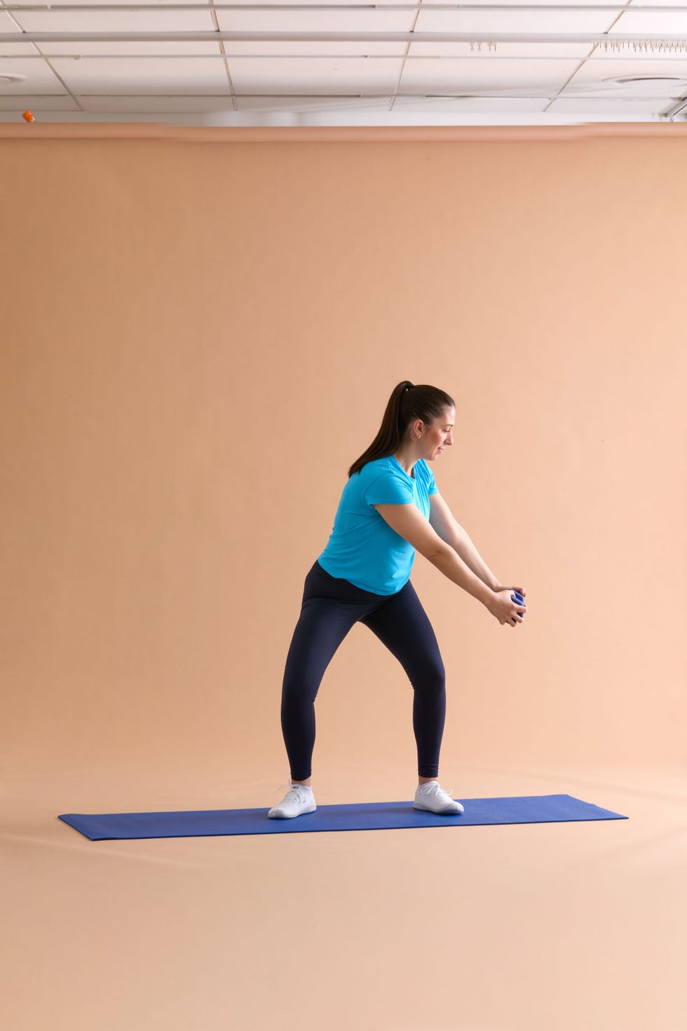 A person performing a fitness exercise on a yoga mat