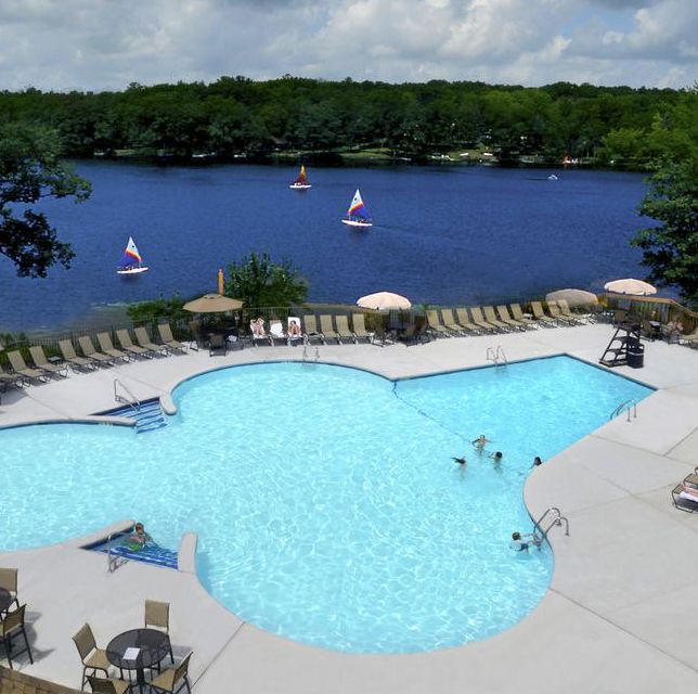 the pool overlooking the lake at woodloch resort, a good housekeeping pick for best all inclusive family resorts