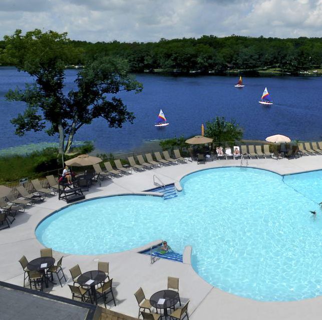 the pool overlooking the lake at woodloch resort, a good housekeeping pick for best all inclusive family resorts