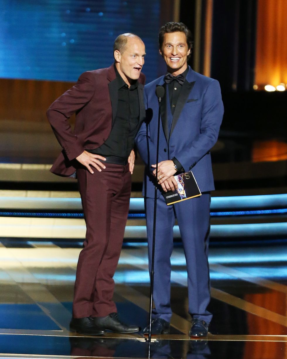 woody harrelson and matthew mcconaughey talking into a microphone on stage