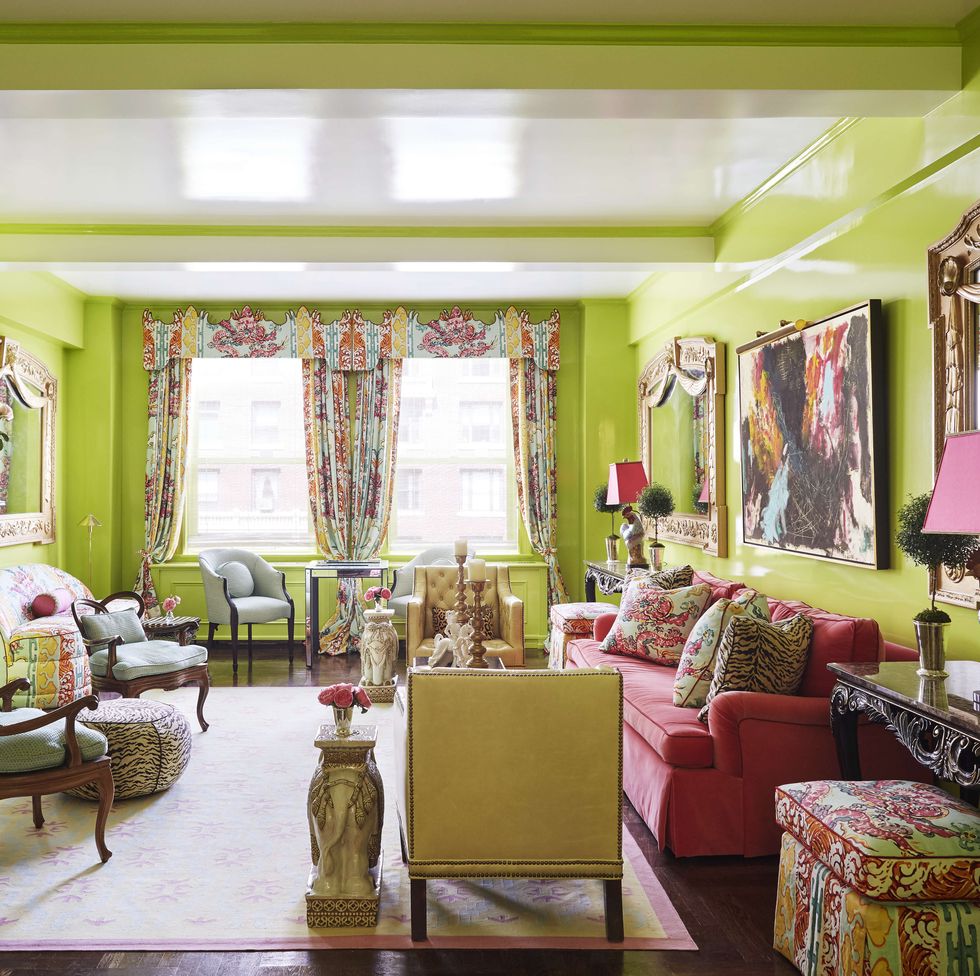 vivid dragon print draperies jim thompson and glossy apple green walls cloak the living room in a carousal of color