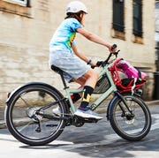 child riding a woom bicycle