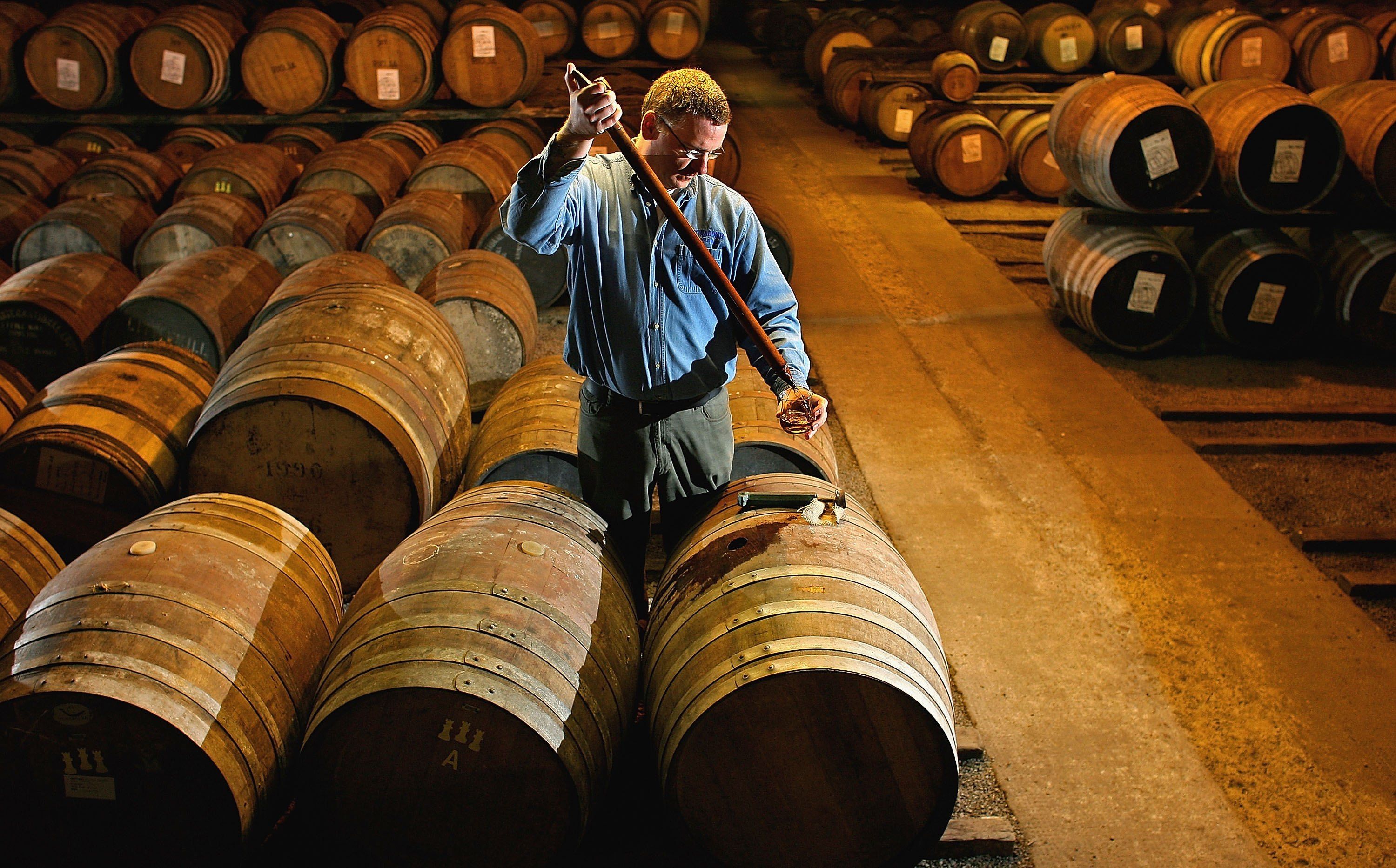 https://hips.hearstapps.com/hmg-prod/images/worker-at-bruichladdich-distillery-takes-a-whisky-sample-news-photo-1683302737.jpg