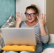 fun facts  girl on laptop looking surprised and excited
