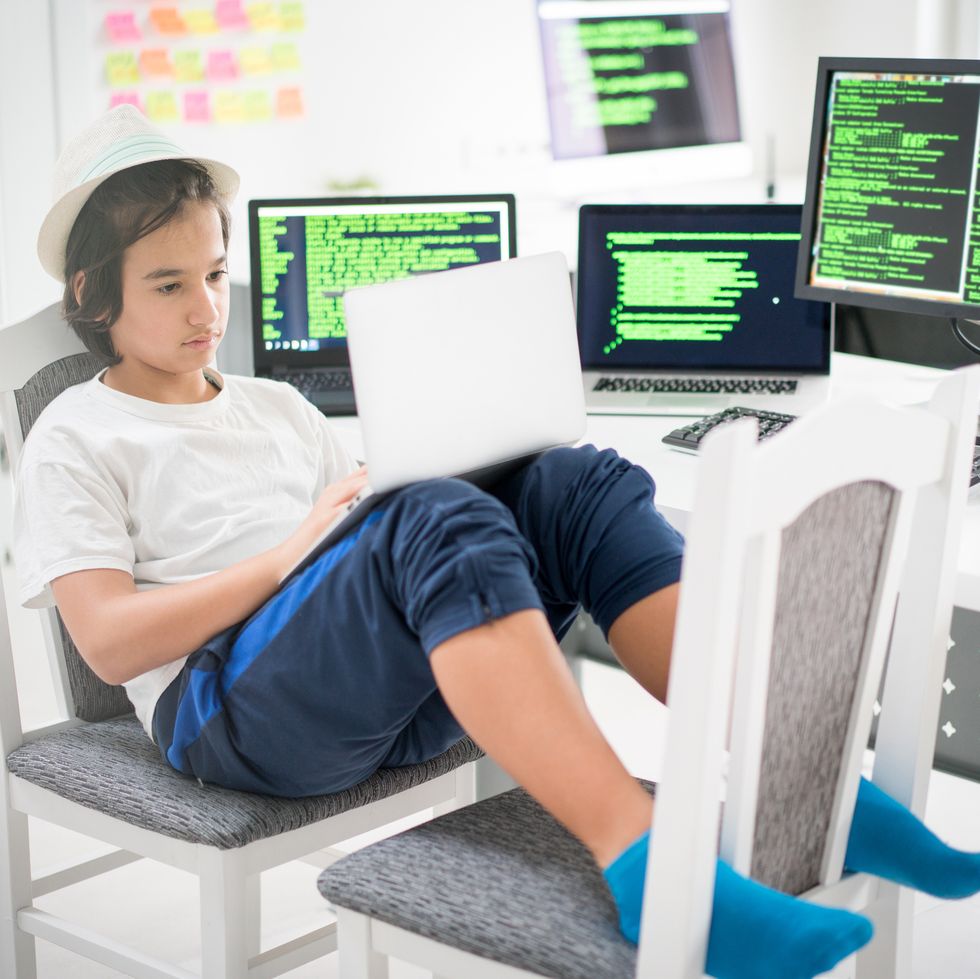 teen working on coding on a computer