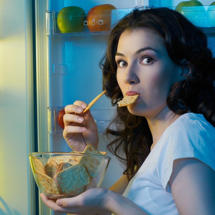 Woman eating late at night.