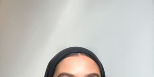 a person wearing a head scarf
