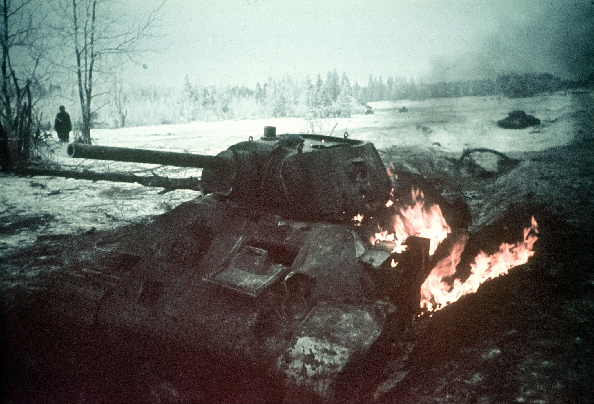 world war ii german forces repel a soviet tank attack in the foreground a hit, burning t 34 tank   no place given   early or late 1943 winter   photographer artur grimm  