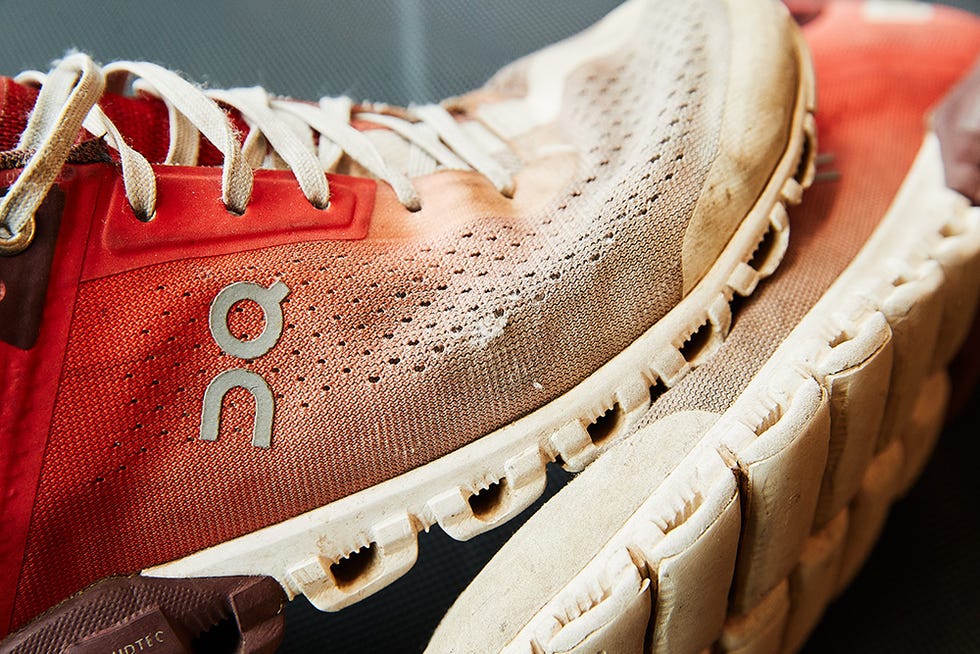 worn running shoes showing signs of use and wear