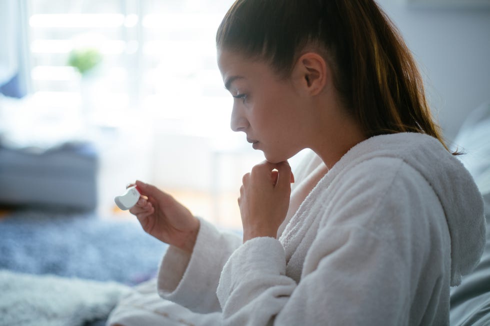 worried woman waiting her pregnancy test results