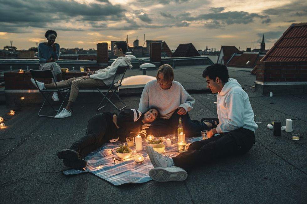 friends talking on a rooftop
