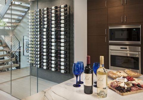 Property, Room, Interior design, Wine bottle, Wine rack, Countertop, Wall, Furniture, Tile, Real estate, 