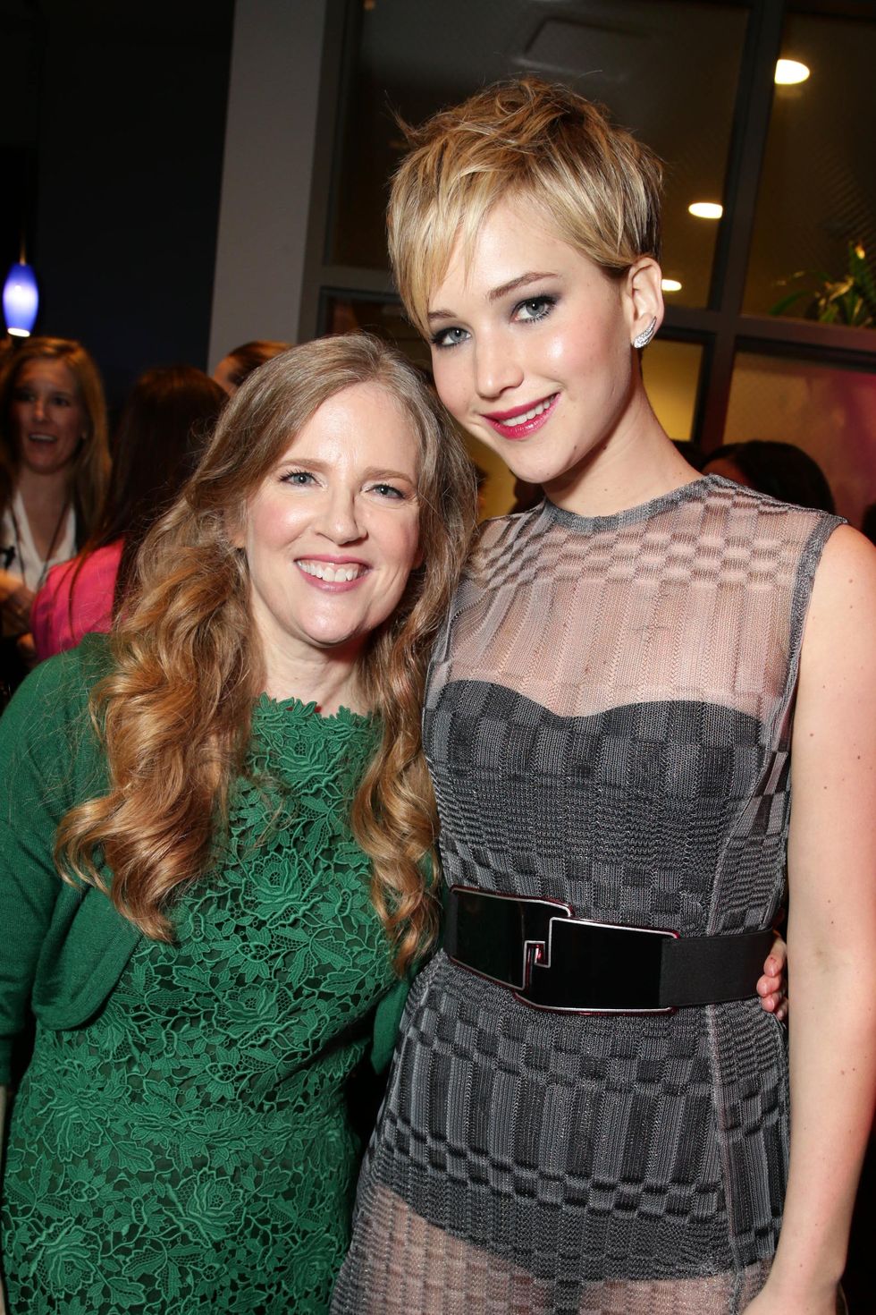 suzanne collins embracing jennifer lawrence for a photo