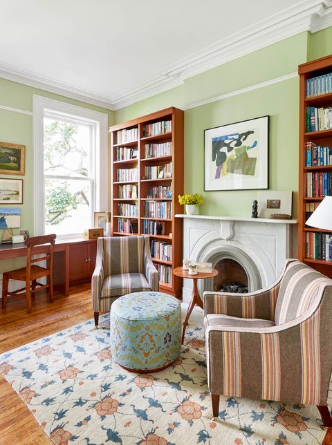 kathleen walsh office, green paint walls, white fireplace, striped chairs, floral ottoman, floral rug