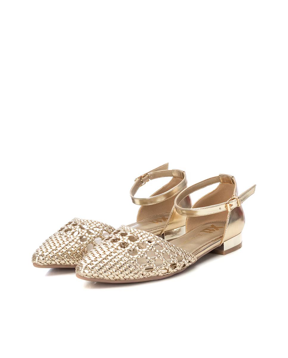 a pair of gold and silver sandals