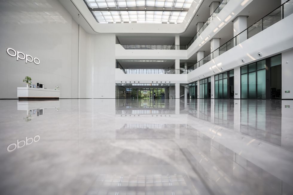 a large white room with glass walls
