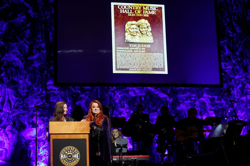 ashley judd and inductee wynonna judd speak onstage for the class of 2021 medallion ceremony at country music hall of fame and museum on may 01, 2022 in nashville, tennessee