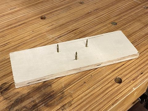 make a finishing stand using screws and a scrap of wood