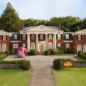 a large brick house with a driveway