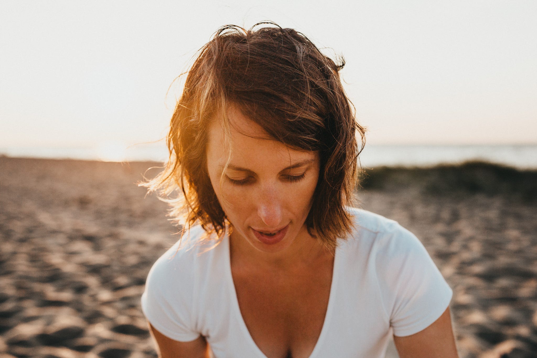 Hair, Face, Beauty, Hairstyle, Beach, Surfer hair, Sea, Summer, Sunlight, Eye, 