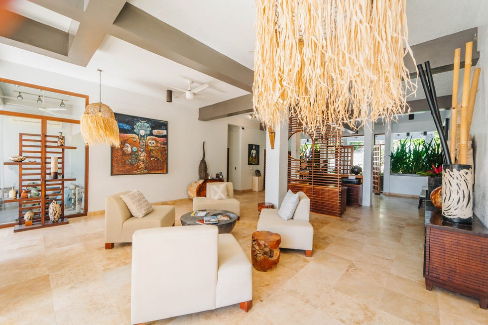 a living room with a chandelier and couches