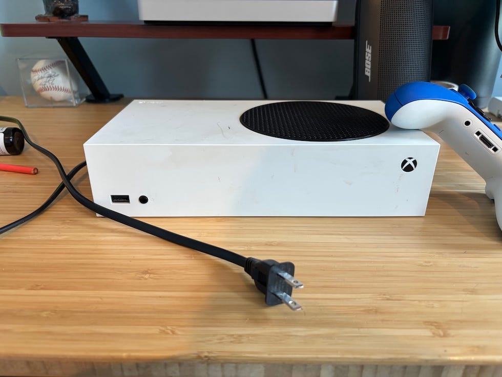 xbox series s console with a controller and power cable