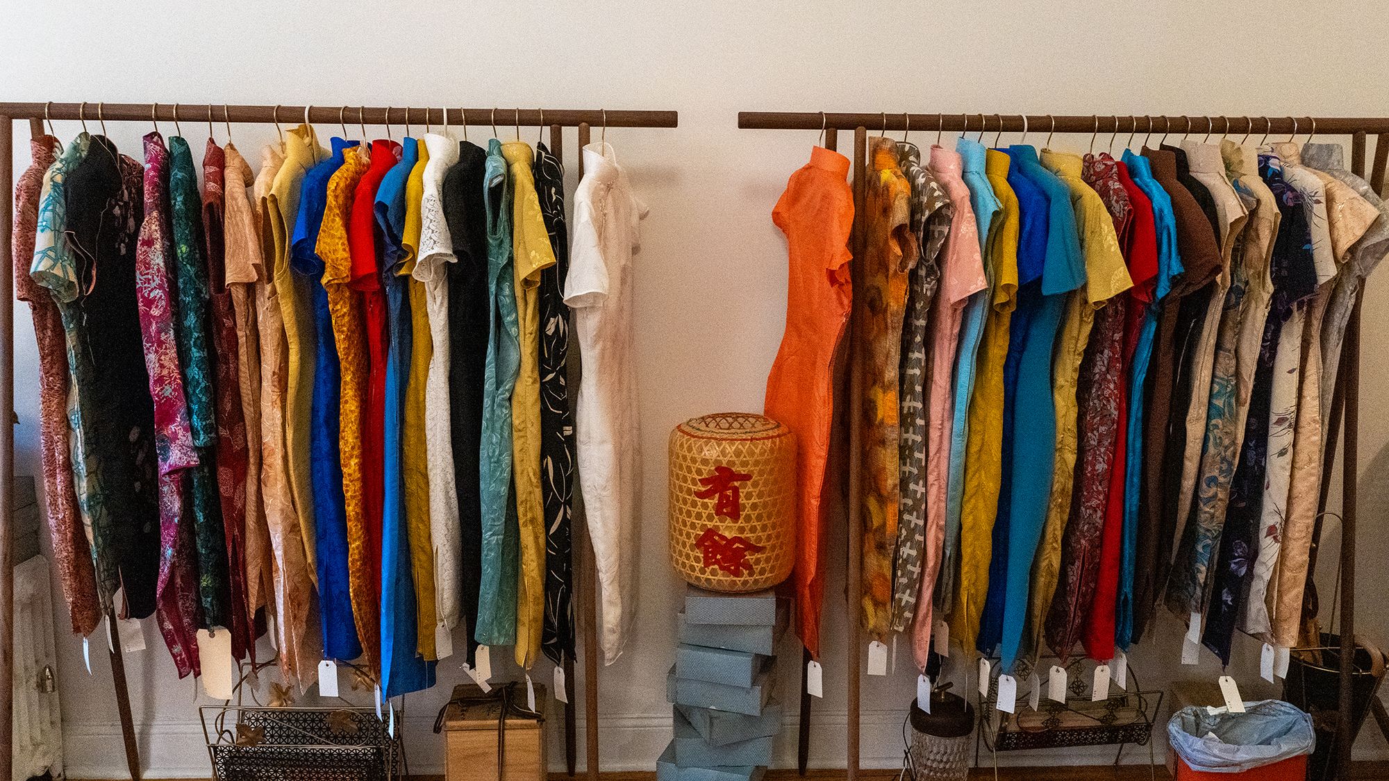 a rack of qipao clothes