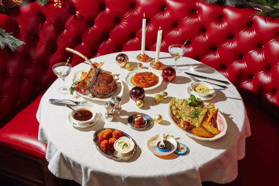 dinner table set with various gourmet dishes and decor