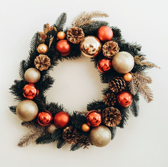xmas wreath with pine cones, red and gold colored toys